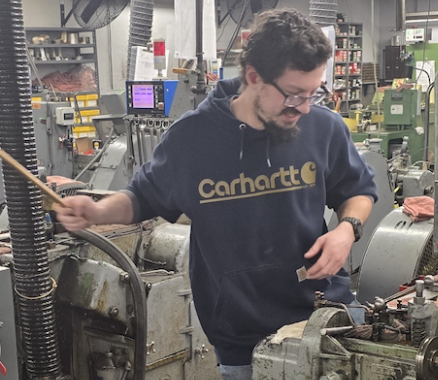 Todd on the shop floor at Crescent, operating a cold-header.